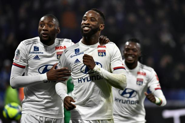 Moussa Dembele (C) scored both goals for Lyon in their 2-0 win ...